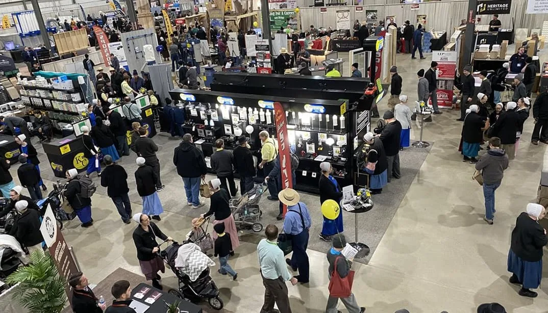 Full expo with booths and attendees walking.